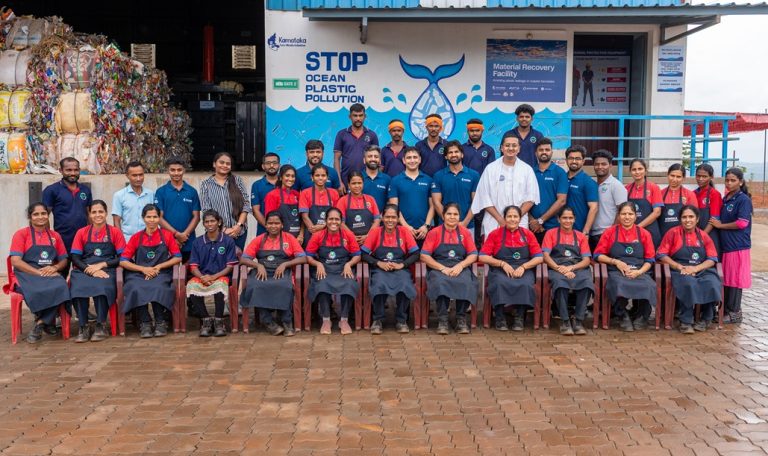 Shivam Agarwal, VP - Strategy, Sattva Group and Aditya Siroya, Co-Founder and Advisor, rePurpose Global with the volunteers and waste workers at the Material Recovery Facility